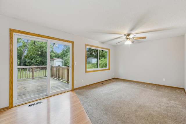 11716 54th St NE, Albertville, MN 55301 - empty room featuring a ceiling fan and wood finished floors