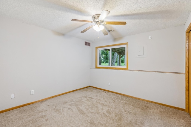 11716 54th St NE, Albertville, MN 55301 - spare room with carpet floors, ceiling fan, and a textured ceiling