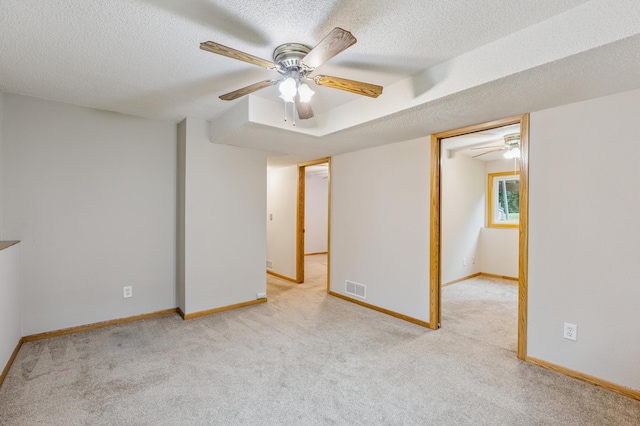 11716 54th St NE, Albertville, MN 55301 - spare room with carpet, a ceiling fan, and a textured ceiling