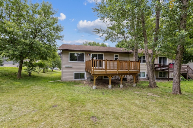 11716 54th St NE, Albertville, MN 55301 - back of property featuring a wooden deck and a lawn
