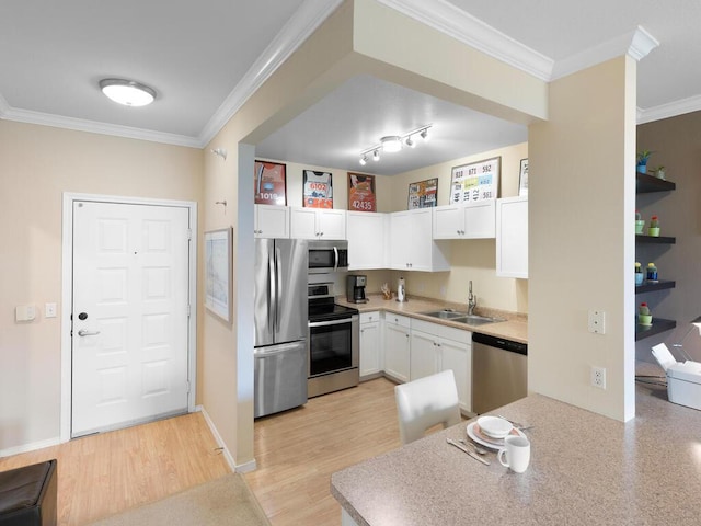13580 Technology Dr Unit 3306, Eden Prairie, MN 55344 - kitchen with stainless steel appliances, white cabinets, ornamental molding, light countertops, and light wood-style flooring