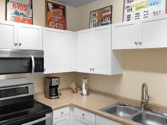 13580 Technology Dr Unit 3306, Eden Prairie, MN 55344 - kitchen featuring appliances with stainless steel finishes, white cabinetry, and light countertops