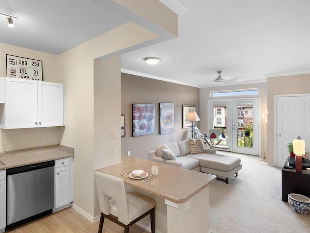 13580 Technology Dr Unit 3306, Eden Prairie, MN 55344 - kitchen featuring dishwasher, white cabinets, crown molding, light countertops, and a peninsula