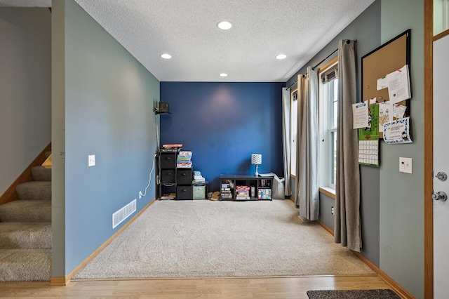 11259 69th St NE, Albertville, MN 55301 - interior space with a textured ceiling, stairway, wood finished floors, and recessed lighting