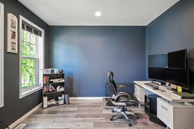 11259 69th St NE, Albertville, MN 55301 - office area with wood finished floors and a textured ceiling