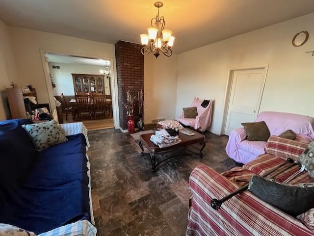 102 4th St S, Grove City, MN 56243 - living room featuring a chandelier
