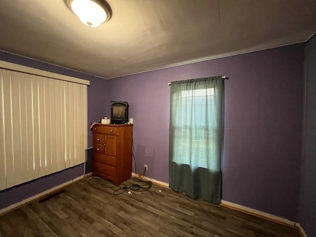 102 4th St S, Grove City, MN 56243 - unfurnished room featuring dark wood-style floors and baseboards