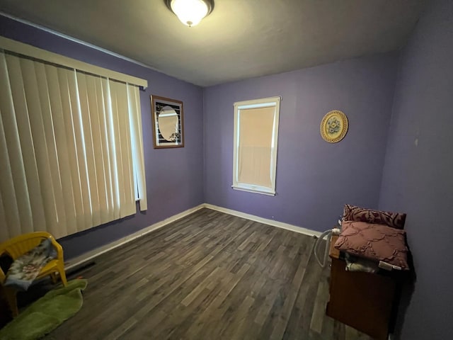 102 4th St S, Grove City, MN 56243 - spare room featuring dark wood-type flooring and baseboards
