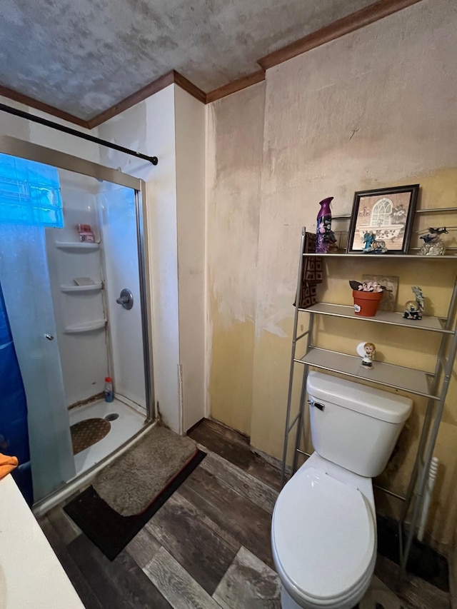 102 4th St S, Grove City, MN 56243 - bathroom featuring a shower stall, wood finished floors, a textured ceiling, and crown molding