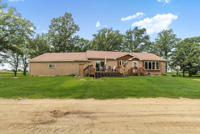 43054 105th Ave, Brockway Twp, MN 56367 - view of front of property featuring brick siding, a wooden deck, and a front lawn