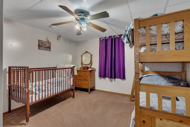 43054 105th Ave, Brockway Twp, MN 56367 - carpeted bedroom with a drop ceiling, ceiling fan, and a nursery area