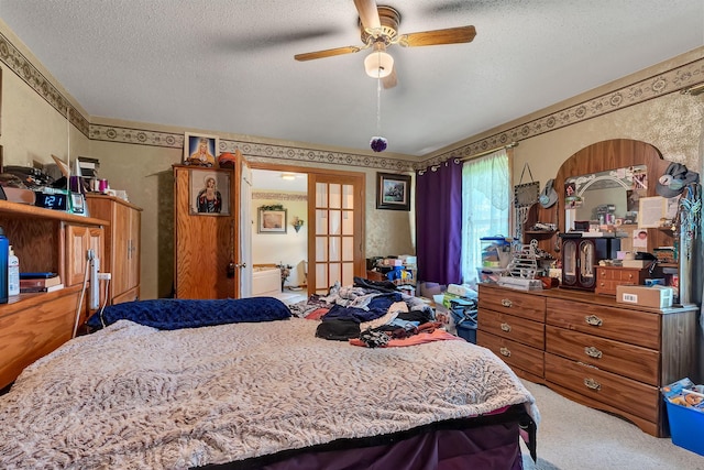 43054 105th Ave, Brockway Twp, MN 56367 - carpeted bedroom with french doors, a textured ceiling, a ceiling fan, and wallpapered walls