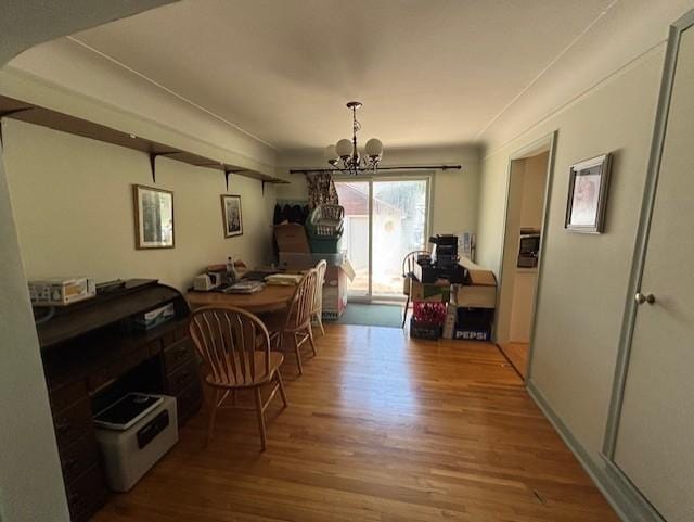 7145 Nicollet Ave S, Richfield, MN 55423 - dining space featuring wood finished floors, a chandelier, and an office area