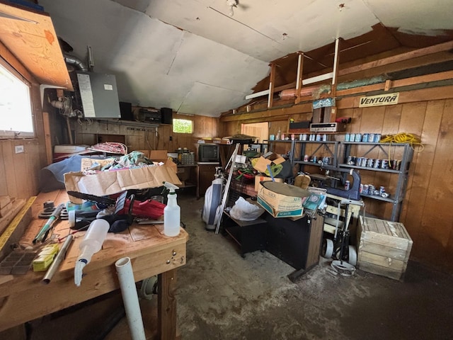 7145 Nicollet Ave S, Richfield, MN 55423 - misc room with wood walls, lofted ceiling, unfinished concrete floors, and a workshop area
