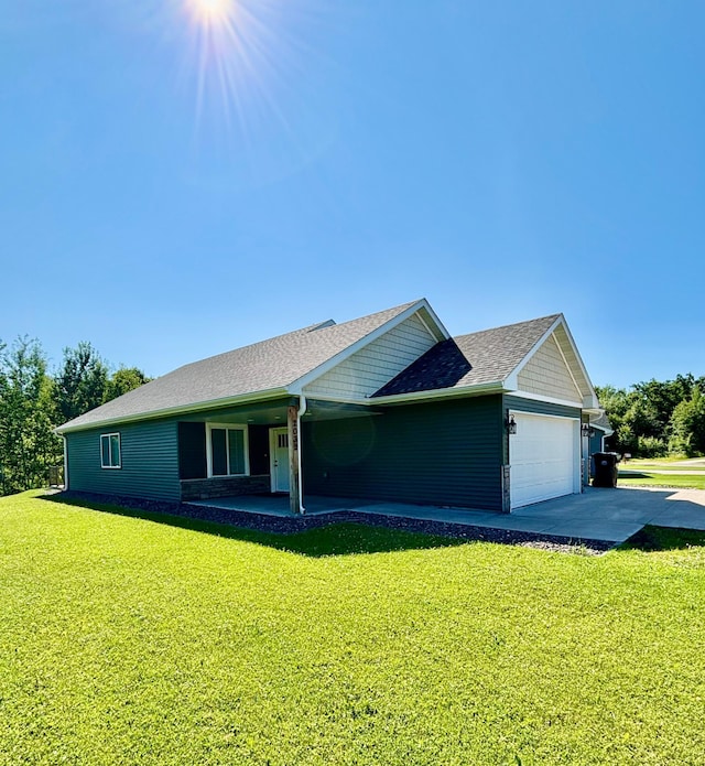 2032 Reuss Pkwy, Saint Croix Falls, WI 54024 - view of front of house with an attached garage, a front yard, driveway, and roof with shingles
