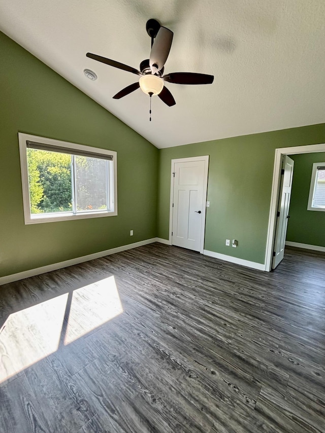 2032 Reuss Pkwy, Saint Croix Falls, WI 54024 - unfurnished bedroom featuring lofted ceiling, dark wood finished floors, and ceiling fan