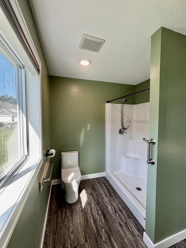 2032 Reuss Pkwy, Saint Croix Falls, WI 54024 - bathroom featuring a shower and wood finished floors