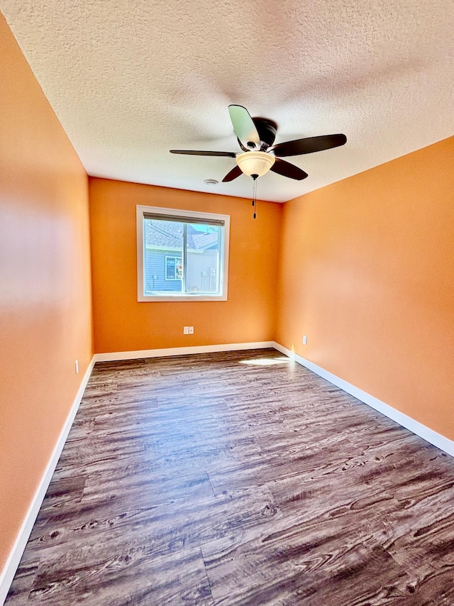 2032 Reuss Pkwy, Saint Croix Falls, WI 54024 - spare room featuring a ceiling fan, wood finished floors, and a textured ceiling