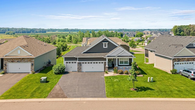 19621 115th Ave N, Rogers, MN 55311 - craftsman-style house with stone siding, covered porch, driveway, a garage, and a front yard