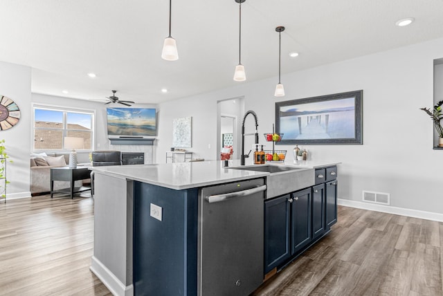 19621 115th Ave N, Rogers, MN 55311 - kitchen featuring stainless steel dishwasher, wood finished floors, light countertops, ceiling fan, and recessed lighting