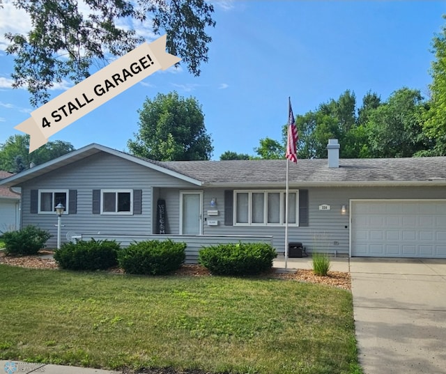 226 30th Ave N, Fargo, ND 58102 - ranch-style home featuring a front yard, an attached garage, and driveway