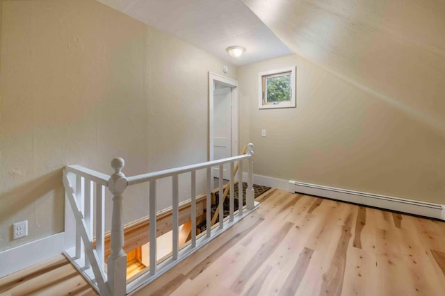 12639 65th Ave SW, May Twp, MN 56466 - stairway with baseboard heating, wood finished floors, and lofted ceiling