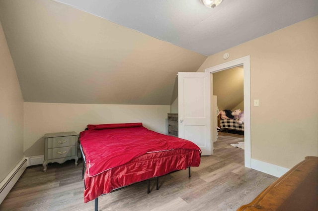 12639 65th Ave SW, May Twp, MN 56466 - bedroom with baseboard heating, vaulted ceiling, and wood finished floors