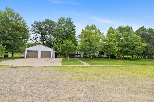 12639 65th Ave SW, May Twp, MN 56466 - view of green lawn featuring an outdoor structure, a garage, and view of scattered trees