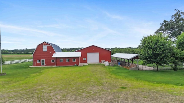 12639 65th Ave SW, May Twp, MN 56466 - view of yard featuring a barn, an outdoor structure, and a detached garage