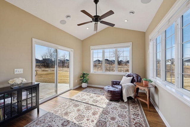 7461 Fir Ln N, Corcoran, MN 55340 - living area featuring vaulted ceiling, wood finished floors, and a ceiling fan