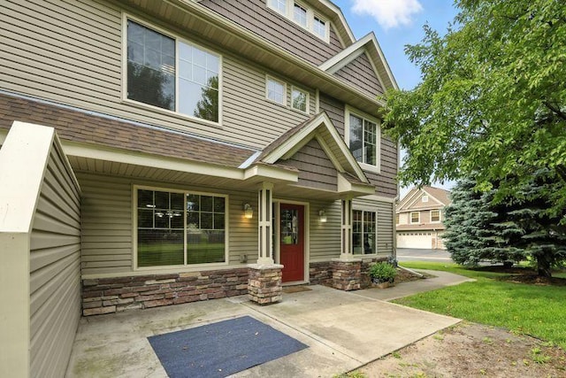 5460 100th Ln N, Brooklyn Park, MN 55443 - entrance to property featuring stone siding and covered porch