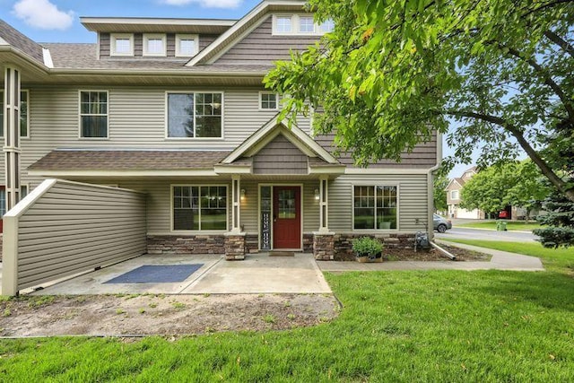 5460 100th Ln N, Brooklyn Park, MN 55443 - craftsman house with a front yard, a shingled roof, and stone siding