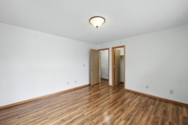 5460 100th Ln N, Brooklyn Park, MN 55443 - unfurnished room featuring wood finished floors and baseboards