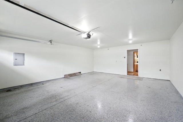5460 100th Ln N, Brooklyn Park, MN 55443 - garage featuring electric panel and a garage door opener