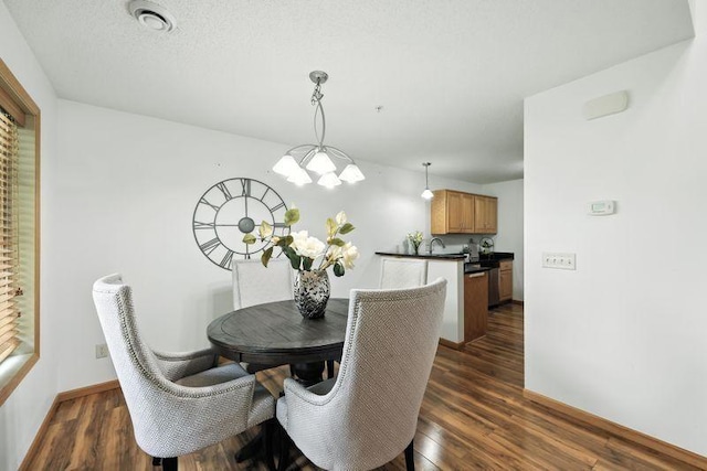 5460 100th Ln N, Brooklyn Park, MN 55443 - dining area featuring dark wood-type flooring and baseboards