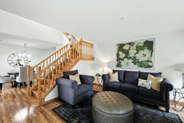5460 100th Ln N, Brooklyn Park, MN 55443 - living room with stairway, wood finished floors, and a chandelier