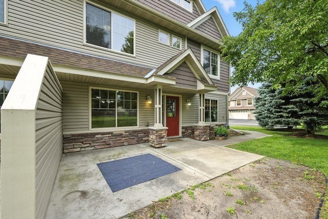 5460 100th Ln N, Brooklyn Park, MN 55443 - property entrance with stone siding and a lawn