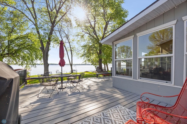 44042 Outlet Beach Rd, Lida Twp, MN 56572 - wooden terrace with a water view and outdoor dining area