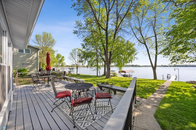 44042 Outlet Beach Rd, Lida Twp, MN 56572 - deck featuring outdoor dining area, a water view, and a lawn