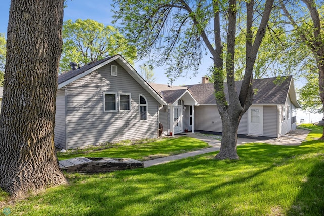 44042 Outlet Beach Rd, Lida Twp, MN 56572 - view of front of property featuring roof with shingles, a front lawn, and a chimney