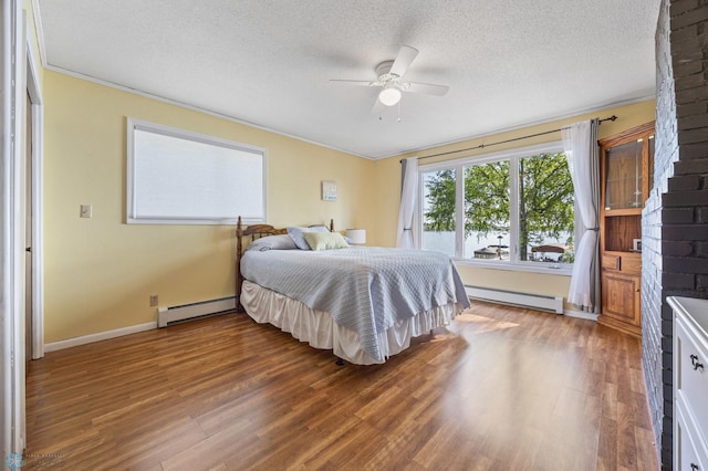 44042 Outlet Beach Rd, Lida Twp, MN 56572 - bedroom featuring a baseboard heating unit, ornamental molding, wood finished floors, a textured ceiling, and ceiling fan