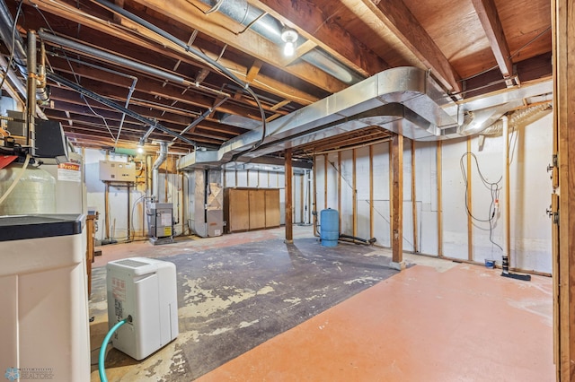 44042 Outlet Beach Rd, Lida Twp, MN 56572 - unfinished below grade area with heating unit, a water pressure tank, and a water softener