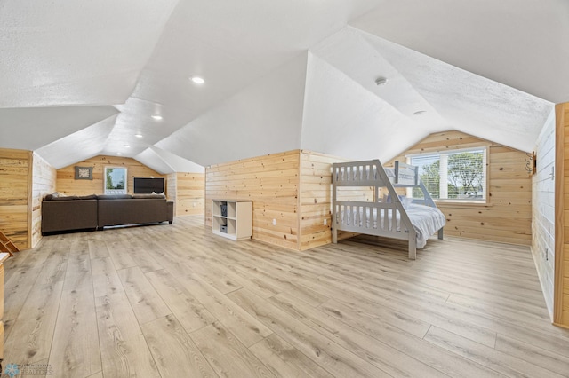 44042 Outlet Beach Rd, Lida Twp, MN 56572 - unfurnished bedroom with wood walls, lofted ceiling, and wood finished floors