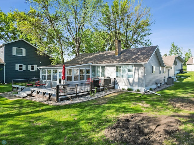 44042 Outlet Beach Rd, Lida Twp, MN 56572 - back of property featuring a wooden deck, a chimney, and a yard