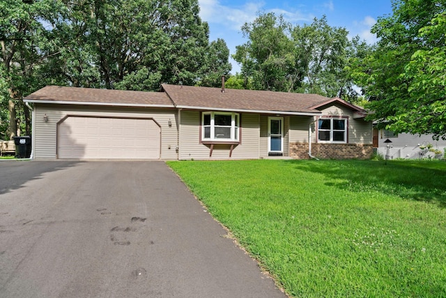 10919 Eagle St NW, Coon Rapids, MN 55433 - ranch-style home featuring asphalt driveway, a garage, a front lawn, brick siding, and roof with shingles