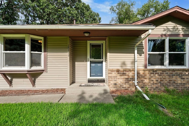 10919 Eagle St NW, Coon Rapids, MN 55433 - view of exterior entry with brick siding