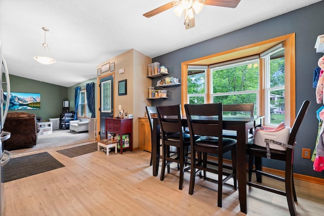 10919 Eagle St NW, Coon Rapids, MN 55433 - dining space featuring light wood-style flooring, ceiling fan, and vaulted ceiling