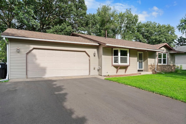 10919 Eagle St NW, Coon Rapids, MN 55433 - single story home featuring an attached garage, a front yard, driveway, and roof with shingles