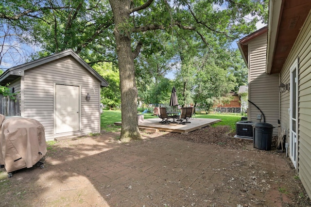 10919 Eagle St NW, Coon Rapids, MN 55433 - view of yard featuring a patio area, outdoor dining area, and an outdoor structure
