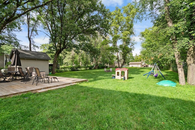 10919 Eagle St NW, Coon Rapids, MN 55433 - view of green lawn with a deck and a playground